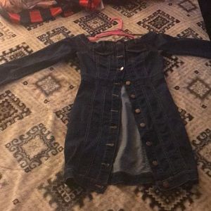 It’s a short dark blue denim dress